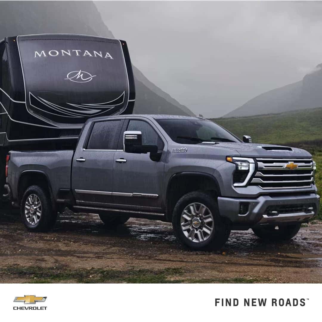 2024 Chevy Silverado HD hauling a trailer while driving off road