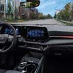 interior of the 2026 Chevy Equinox with a view of a neighborhood