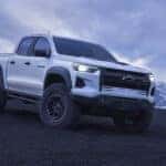 A white 2026 Chevy Colorado on a hill