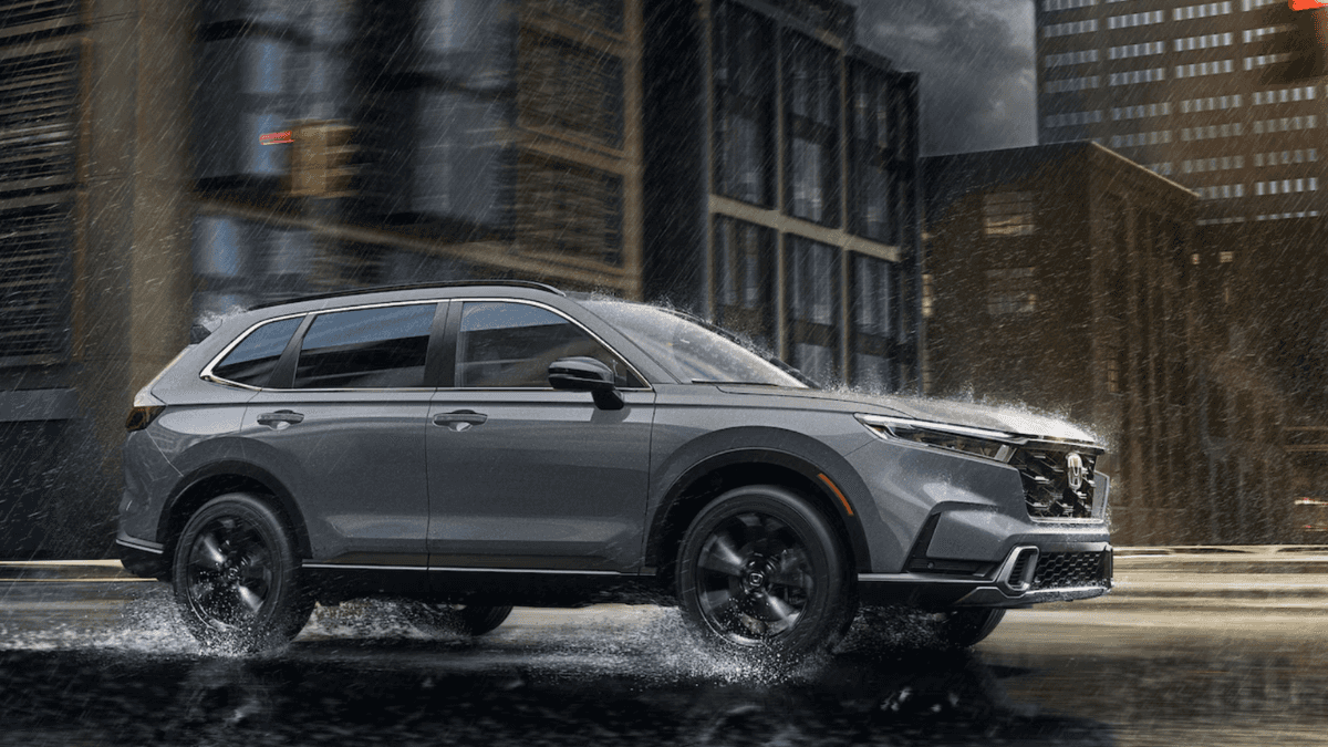 Side profile of the 2026 Honda CR-V on a rainy city street