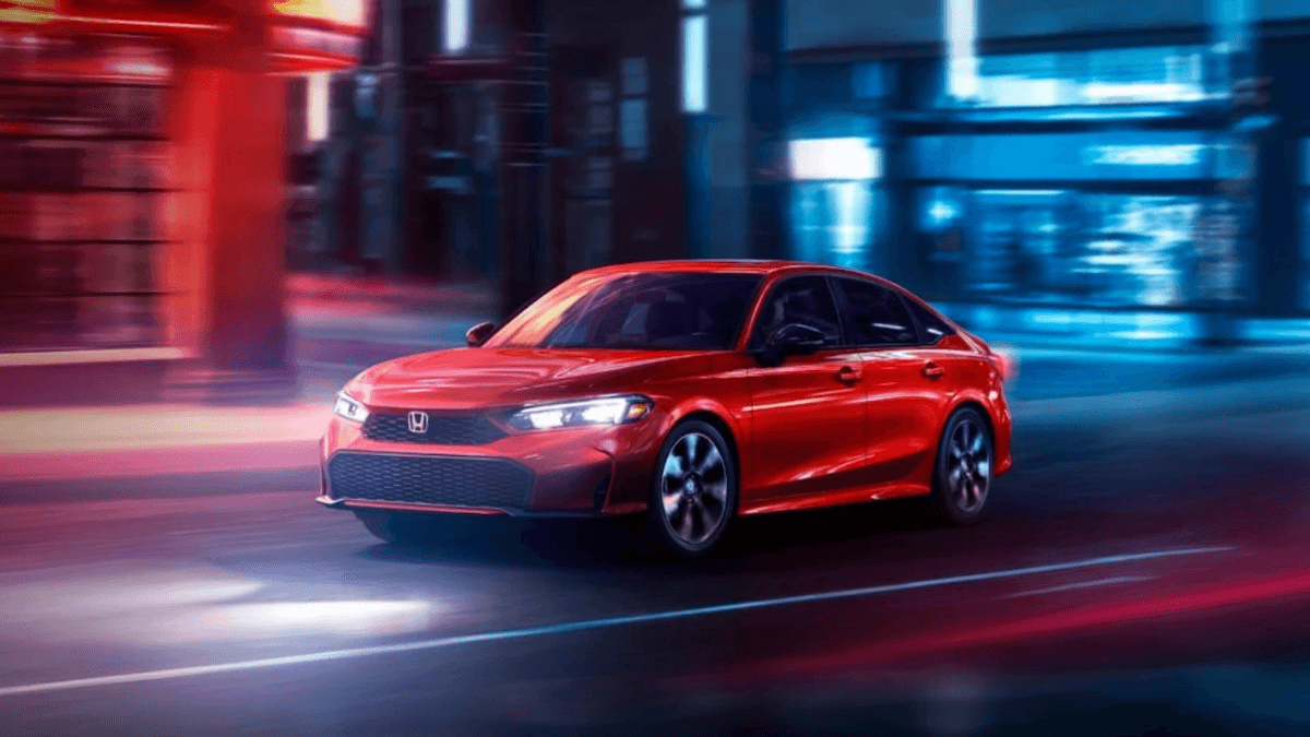 2026 Honda Civic in red on a city street at night
