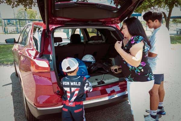 Family using the trunk of a 2019 Chevy Equinox