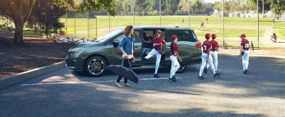 Family Hopping out of 2021 Honda Odyssey