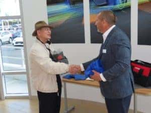 client and dealer shaking hands hands