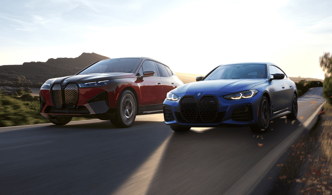 Red and Blue Car Driving Down Fall Road