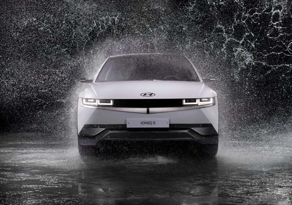 Grayscale Photo of a Hyundai Ioniq 5 in the Rain