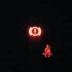 warning light displayed on a car dashboard