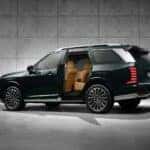 black hyundai palisade with doors open revealing a brown interior