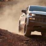 Chevy Silverado driving across rocky terrain