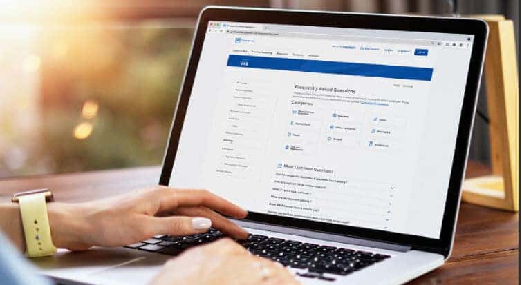 person at laptop checking finance options