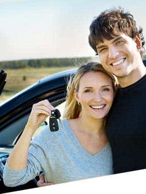 Man and woman holding car keys