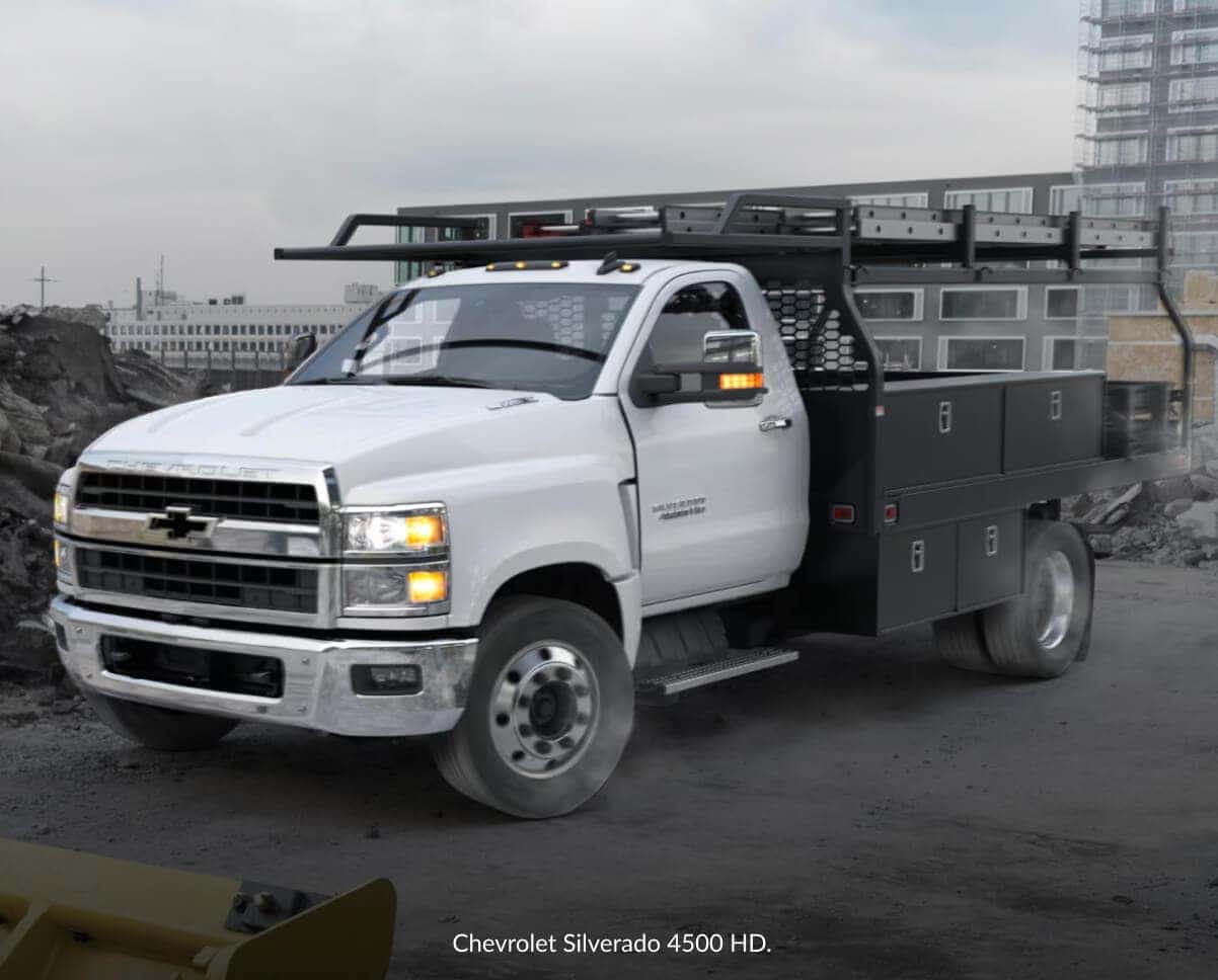 Three-quarter view of a white Chevrolet Silverado 4500 HD utility truck equipped with a rack.