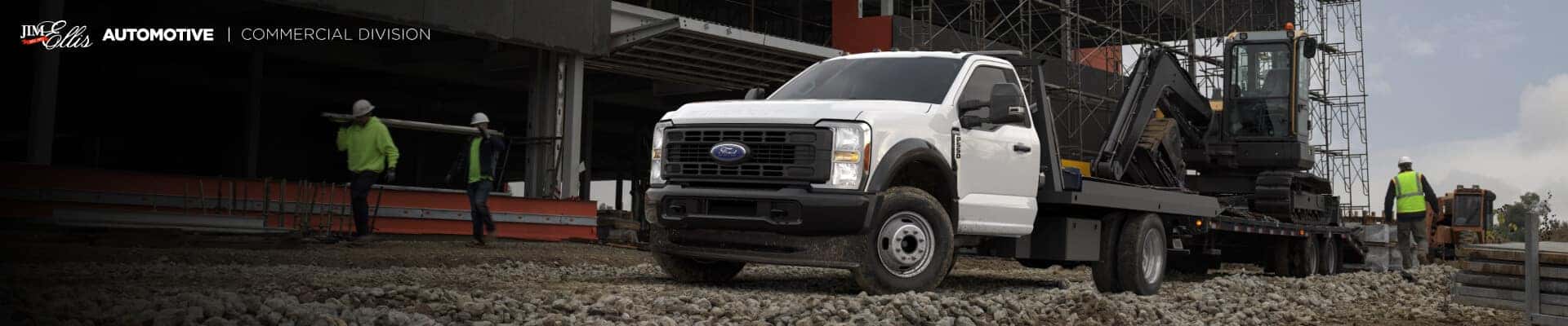 2025 Ford Super Duty F-550 XL Chassis Cab in Oxford White hauling construction equipment at a job site.