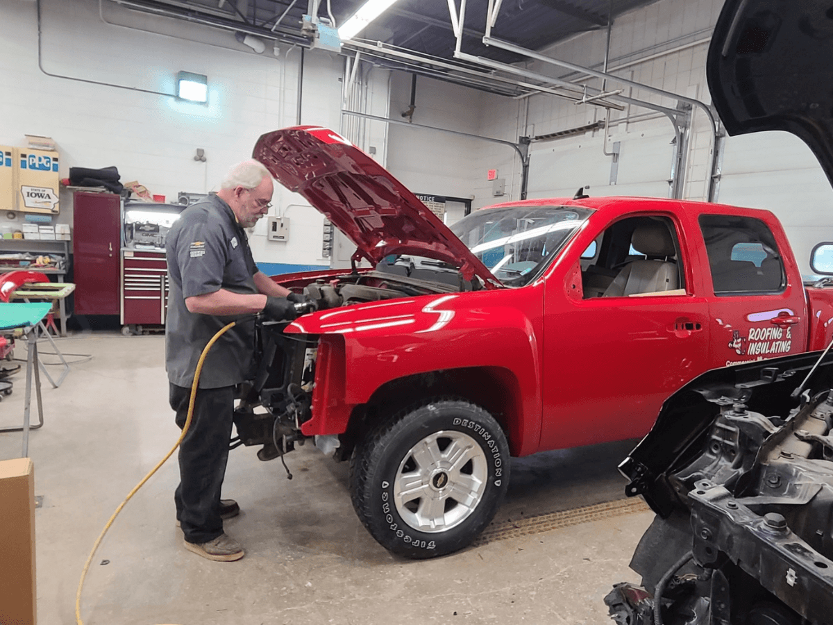 Auto Body Shop Technician Working on Truck