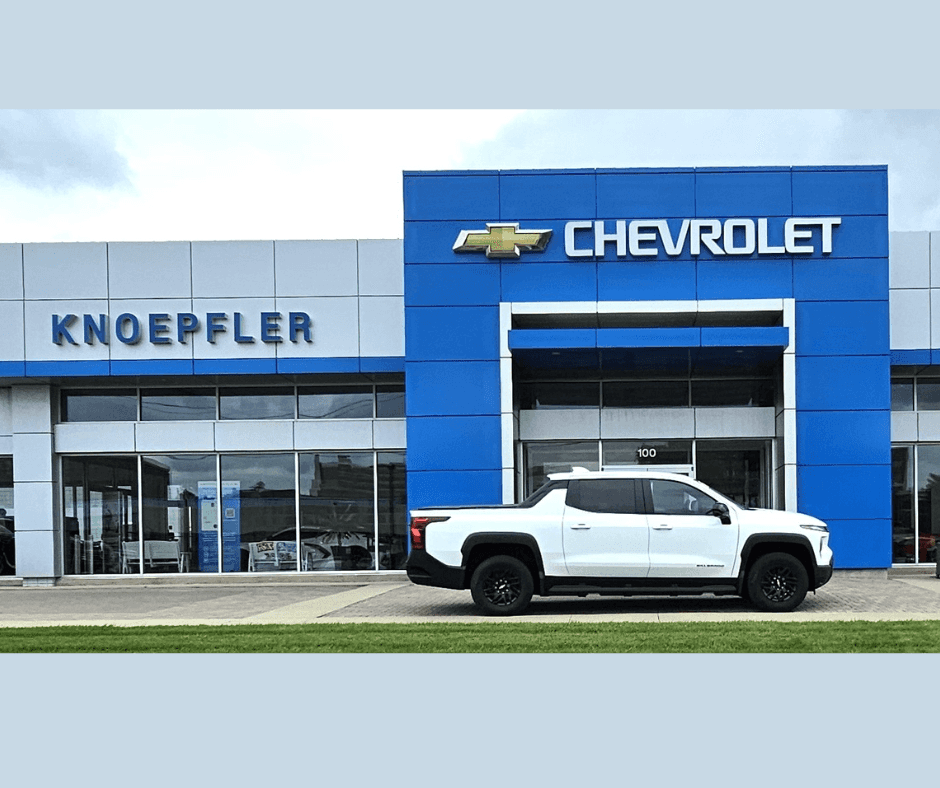 Electric Silverado in Front of Dealership Knoepfler Chevrolet