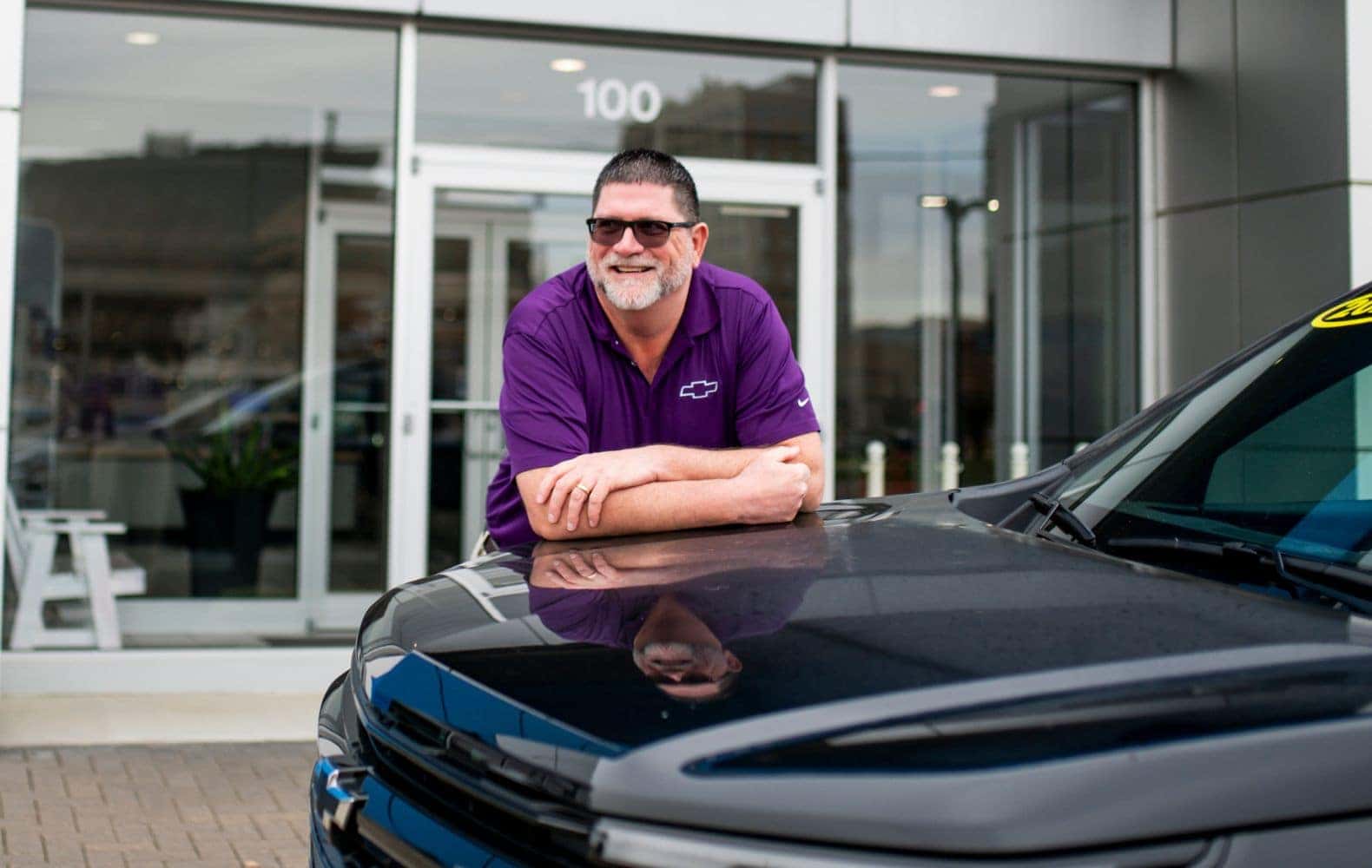 Mike McVay Director In Front of Easiest Dealership in Sioux City to Trade Vehicle