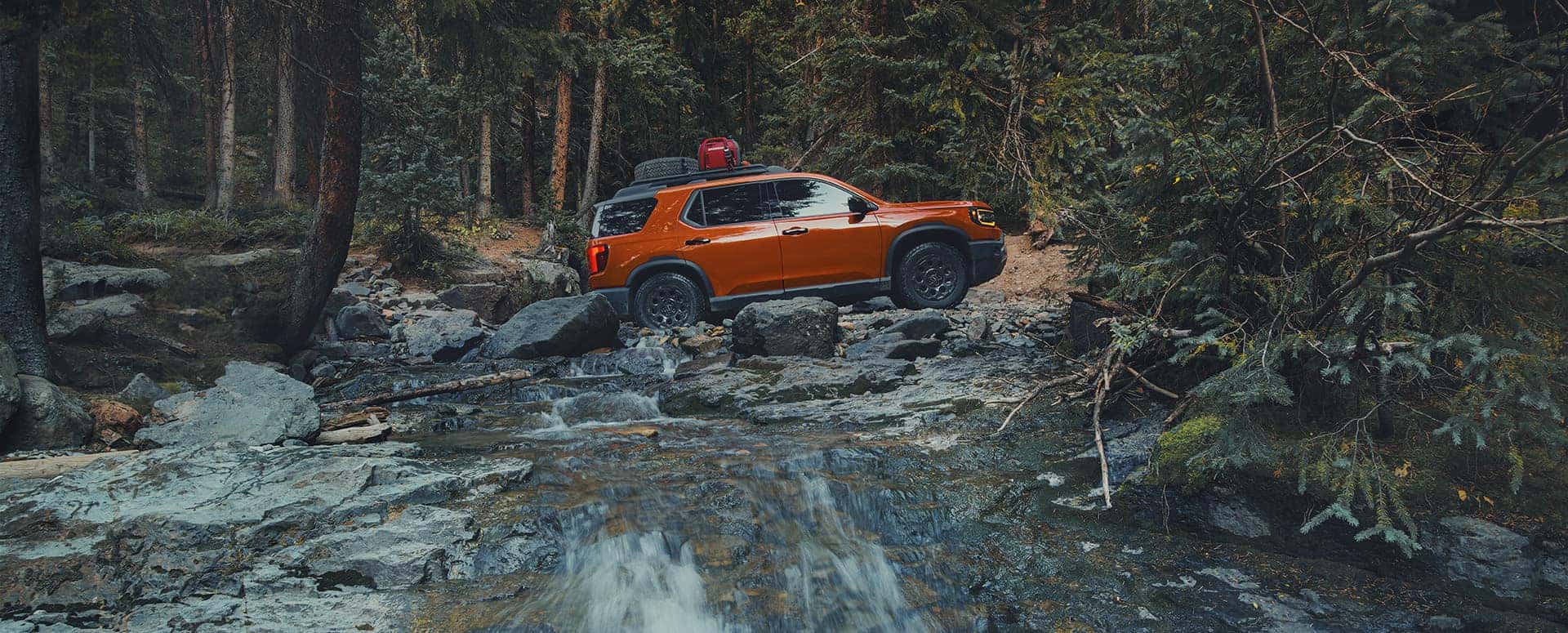 New Orange Honda Passport off roading
