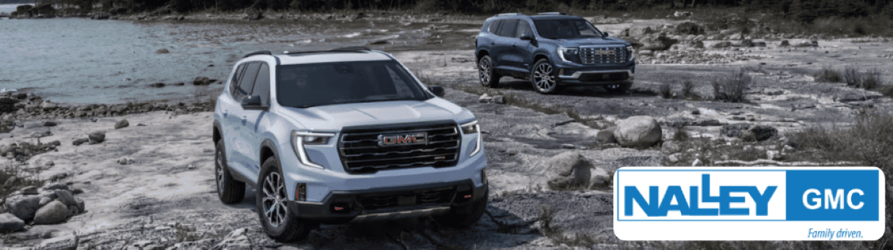 Nalley GMC dealership in Brunswick, GA, showcasing a GMC Acadia SUV in a scenic location.