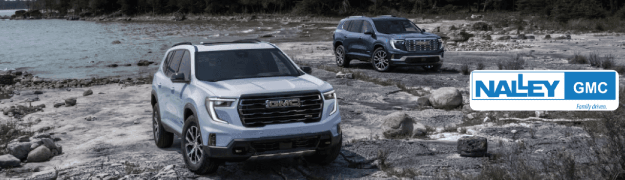 GMC Acadia parked near a scenic Brunswick, GA shoreline, highlighting its versatility and style.