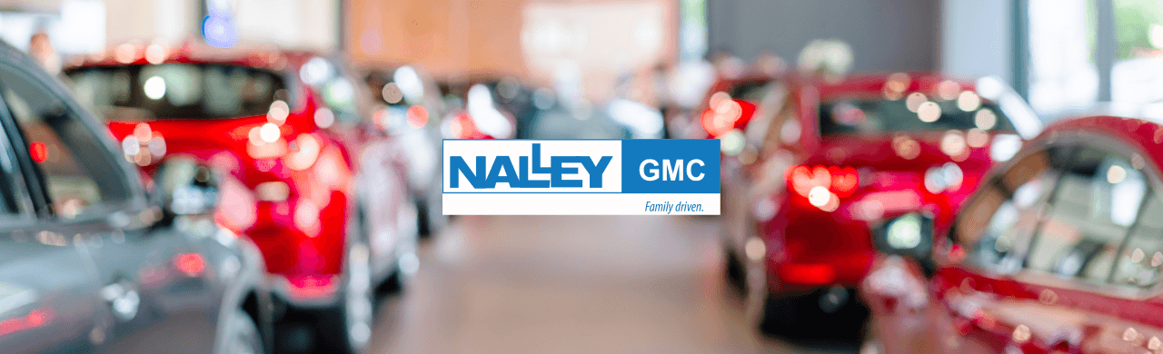 cars for sale at Nalley GMC in Brunswick, GA, with a backdrop of the dealership.