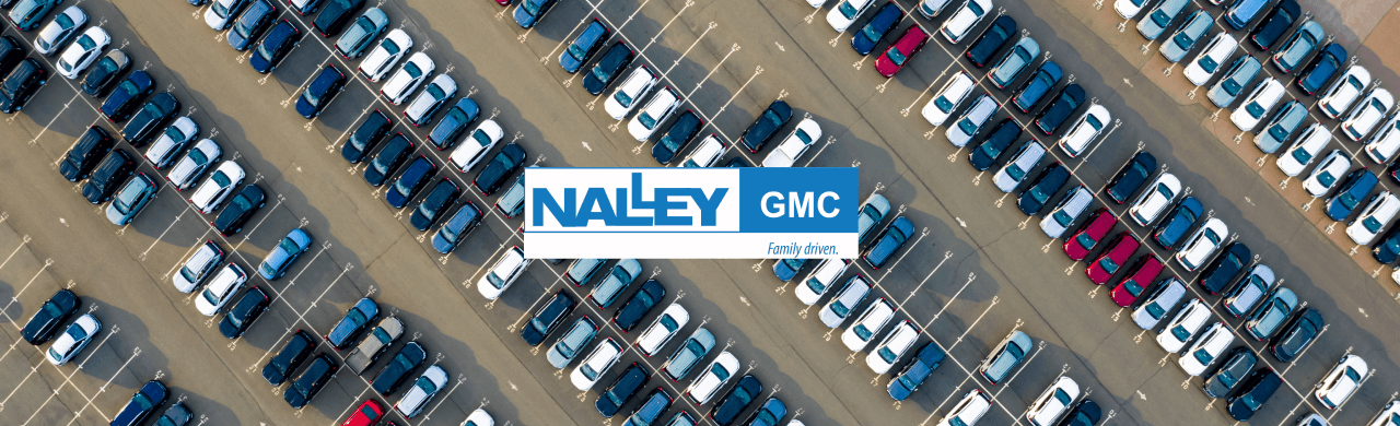 Exterior view of Nalley GMC in Brunswick, GA, showcasing a variety of used cars.