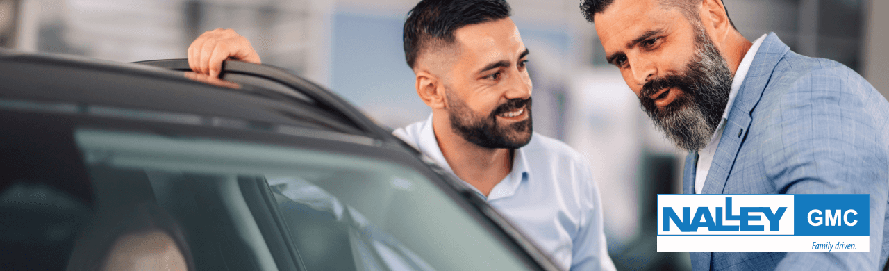 Happy customers are exploring a wide selection of used cars at the Nalley GMC dealership in Brunswick, GA.