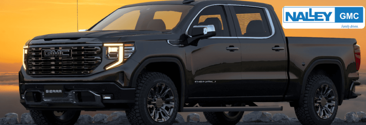 Close-up of a GMC Sierra parked at Nalley GMC in Brunswick, GA, emphasizing its premium design and rugged capability.