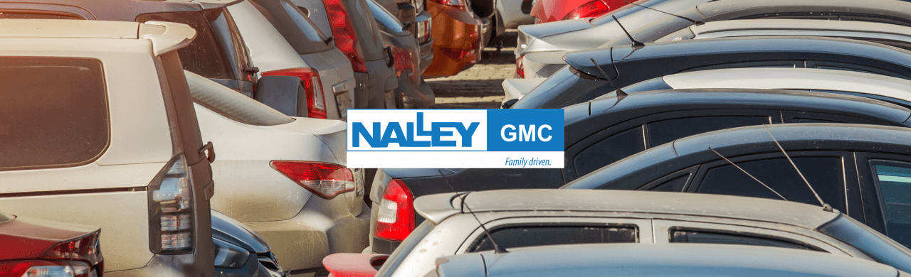 Nalley GMC dealership in Brunswick showcasing a variety of used cars on the lot.