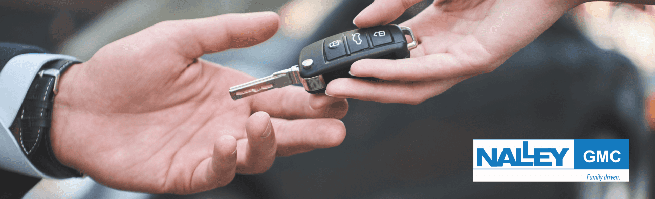 Nalley GMC sales team assists customers with pre-owned vehicle selection in Brunswick, GA.