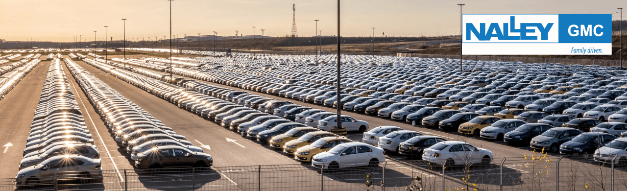 Nalley GMC dealership in Brunswick showcasing a variety of used cars on the lot.