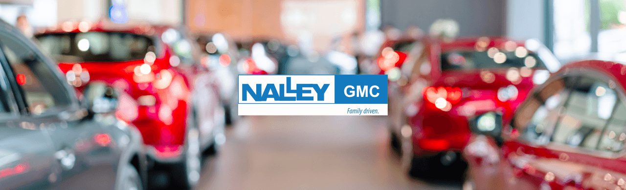 Photo of Nalley GMC dealership in Brunswick, GA, showcasing a variety of new and used vehicles ready for sale.