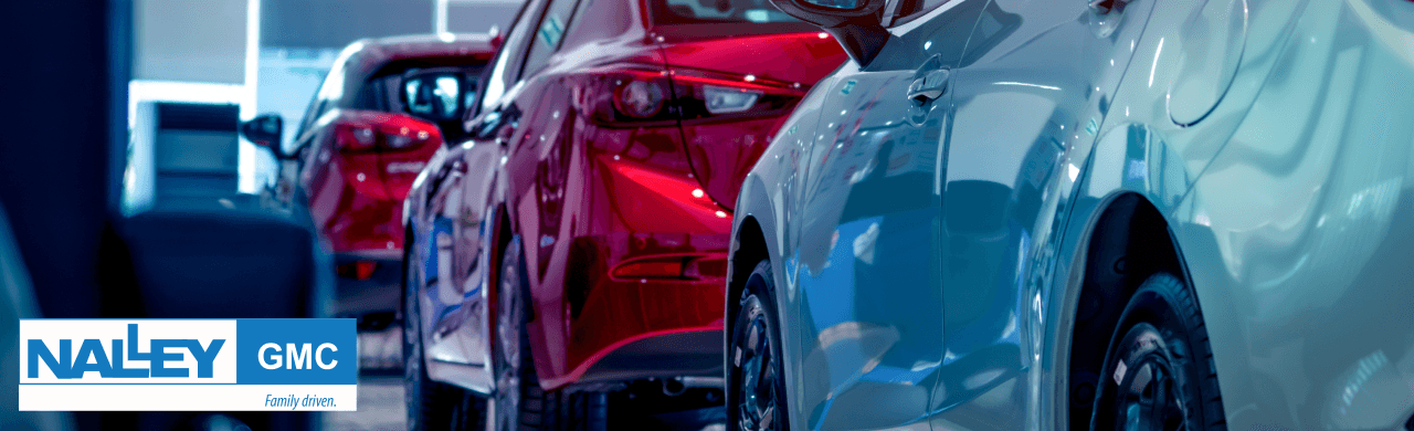 Nalley GMC dealership in Brunswick, GA, features a vibrant lineup of new and used vehicles displayed on the lot.