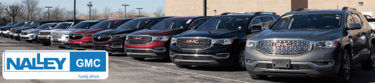 The exterior of the Nalley GMC dealership showcases a wide selection of used cars on sale in Brunswick, GA.