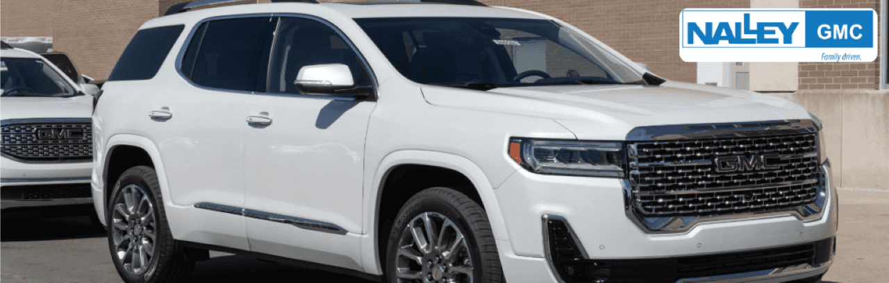 A sleek 2023 GMC Acadia Denali parked in front of Nalley Buick GMC dealership in Brunswick, GA.