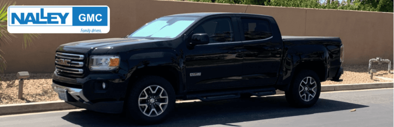 A close-up of a 2023 GMC Canyon for sale at Nalley Buick GMC, emphasizing its sleek design and high-performance features.