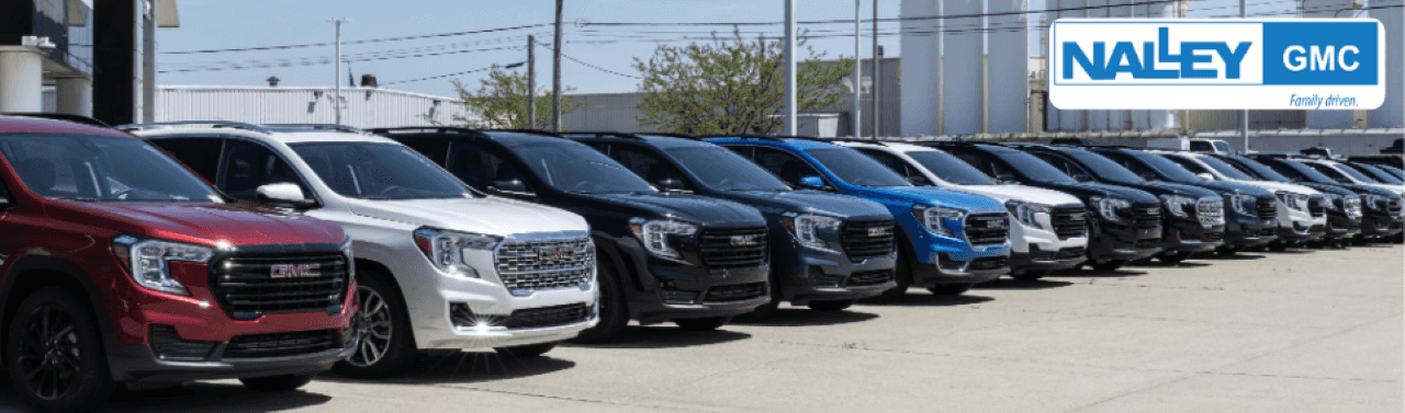 Certified pre-owned SUVs parked in a dealership lot at Nalley Buick GMC in Brunswick, GA.