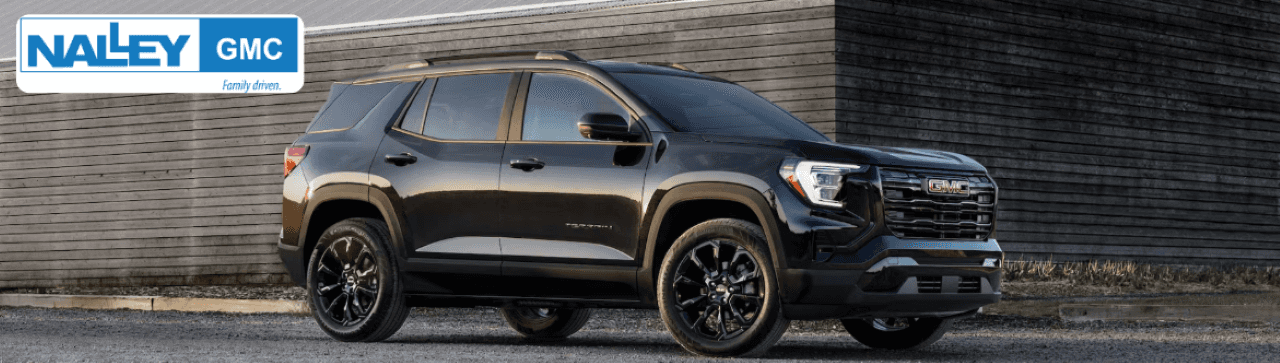 A black GMC Terrain SUV parked in front of Nalley Buick GMC dealership in Brunswick, GA.