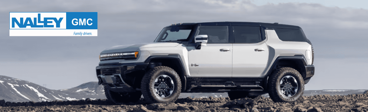 A high-performance GMC Hummer EV SUV on rugged terrain showcasing its off-road capabilities.