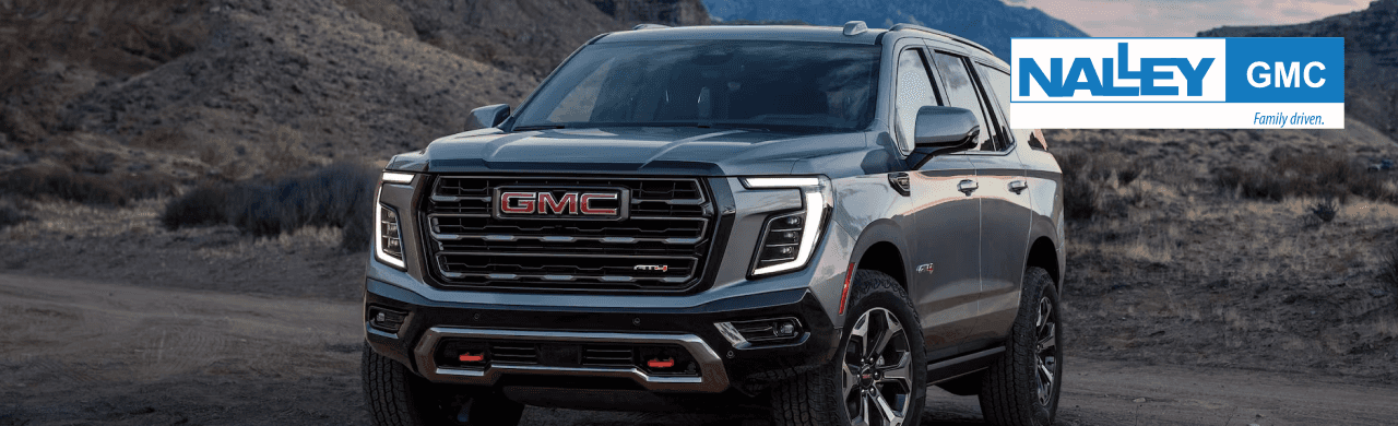 A sleek GMC Yukon SUV parked at Nalley GMC dealership in Brunswick, GA, ready for a test drive.