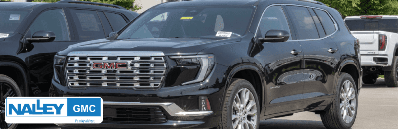 Customers browsing GMC SUV inventory near Waycross, GA at Nalley Brunswick GMC showroom.