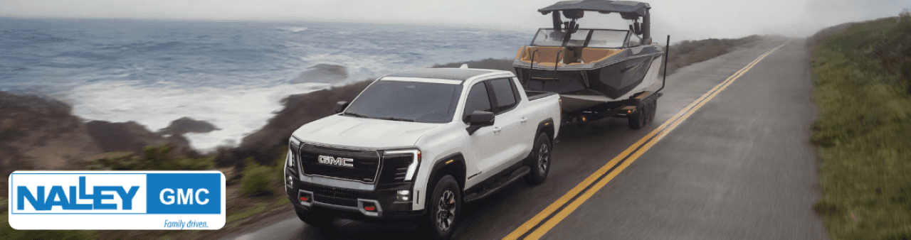 2025 GMC Sierra EV parked at Nalley GMC Brunswick showcasing its rugged design and EV styling.