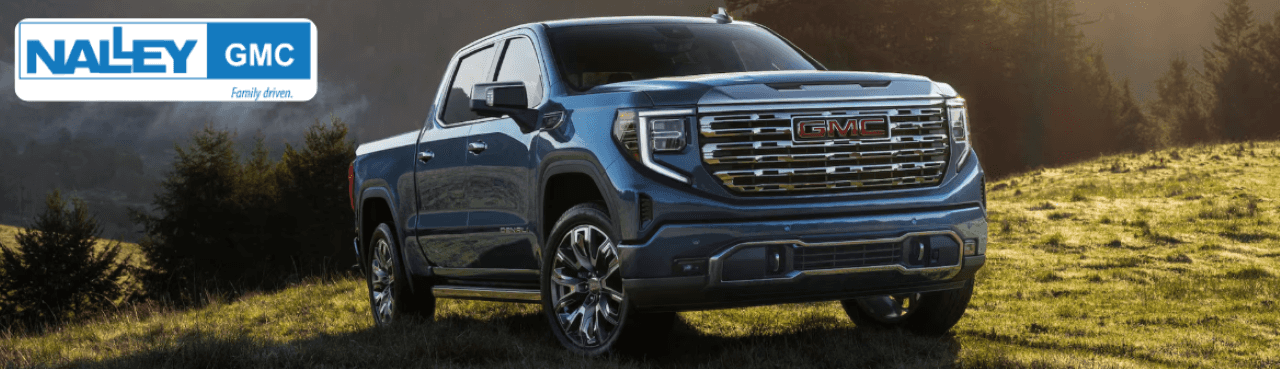 GMC Sierra Denali truck parked outside Nalley GMC Brunswick, showcasing luxury design and chrome accents