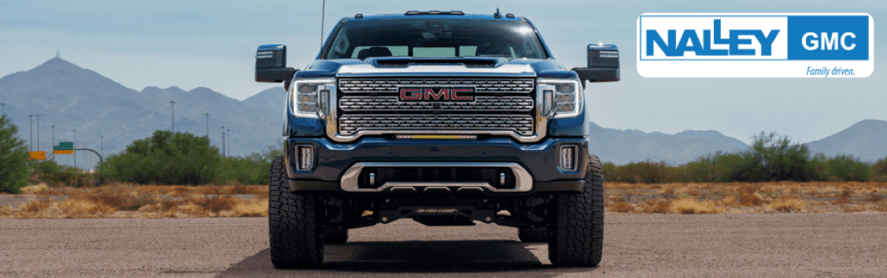 A GMC Sierra equipped with genuine GMC accessories, including a bed liner and chrome trim at Nalley Brunswick GMC.