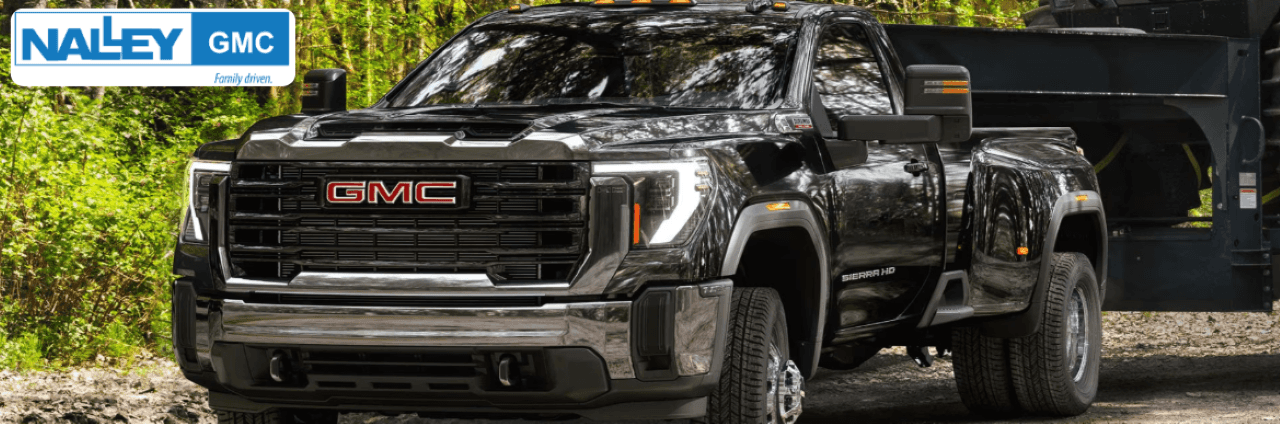 GMC Sierra 3500 HD hauling equipment, showcasing its towing power and heavy-duty build near Savannah, GA.