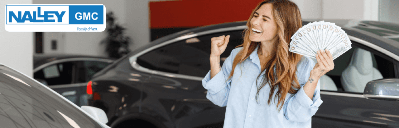 Customer comparing KBB estimate to Max Allowance real offers at Nalley GMC Brunswick near Macon, GA