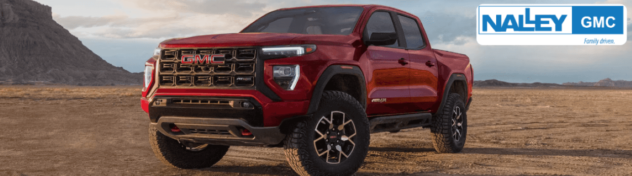 A new GMC Canyon parked outside Nalley Brunswick GMC in Brunswick, GA, showcasing rugged midsize truck design.