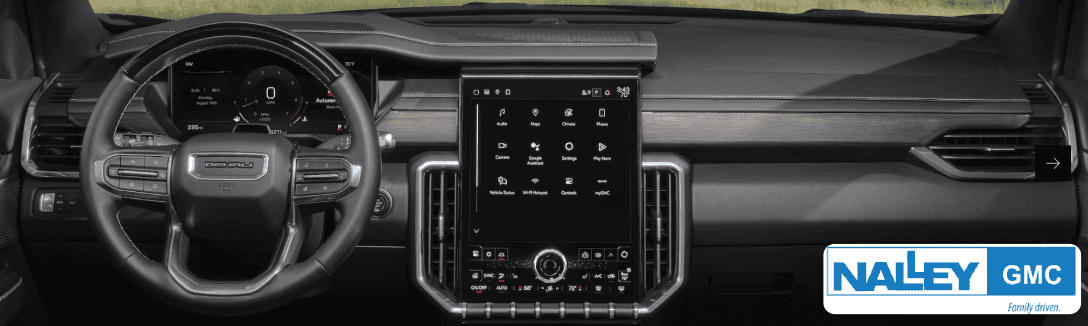 Interior of the 2025 GMC Acadia highlighting spacious third-row seating and advanced infotainment features for road trips across Georgia.