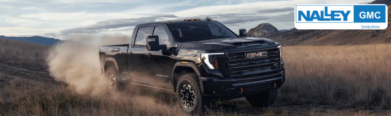 GMC Sierra 2500 HD parked near Brunswick marina, showing its rugged front grille and chrome detailing.