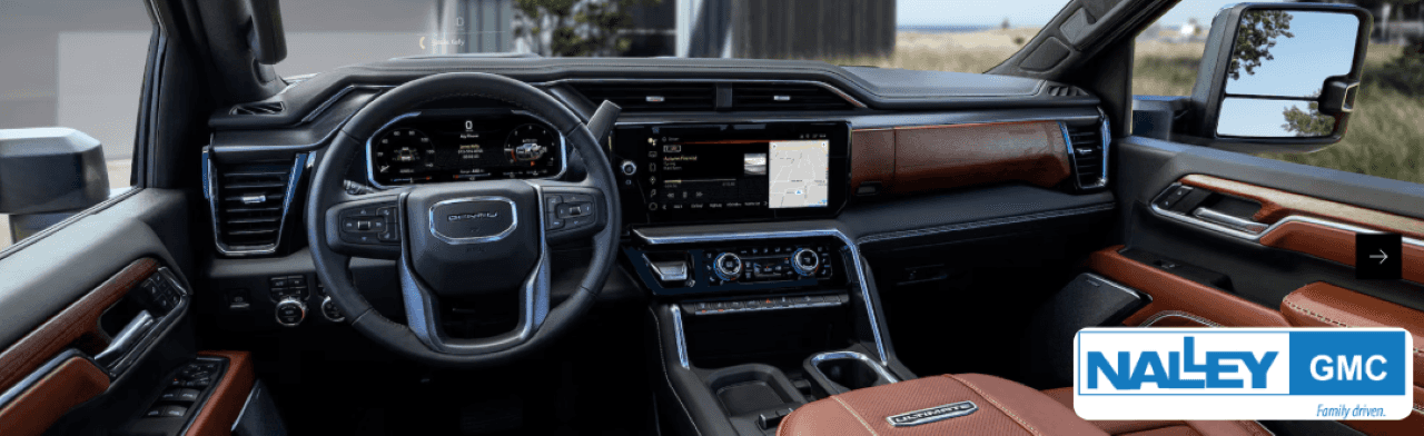 Interior cabin of GMC Sierra 2500 HD highlighting premium materials and tech features ideal for long hauls.