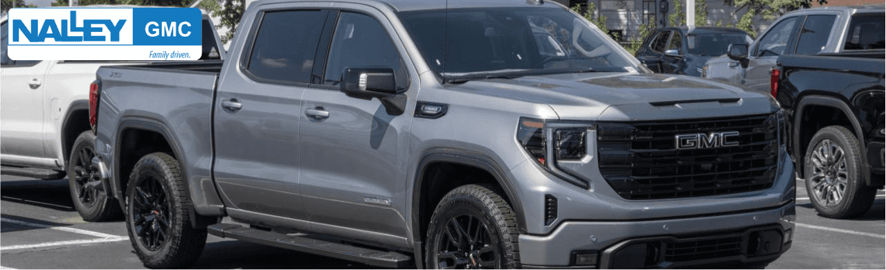 Row of new and pre-owned GMC diesel trucks at Nalley Brunswick GMC in Brunswick, GA